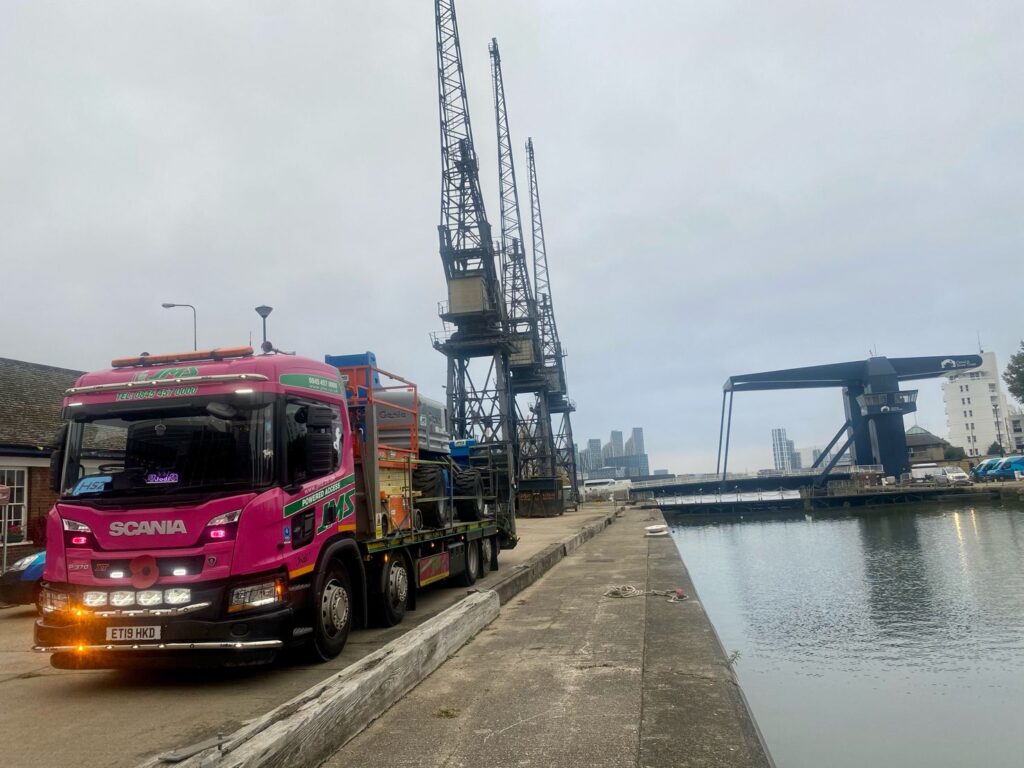 Jodi Smith delivering scissor lift in Canary Wharf, London